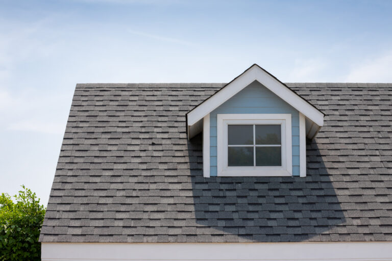 Roof shingles with garret house on top