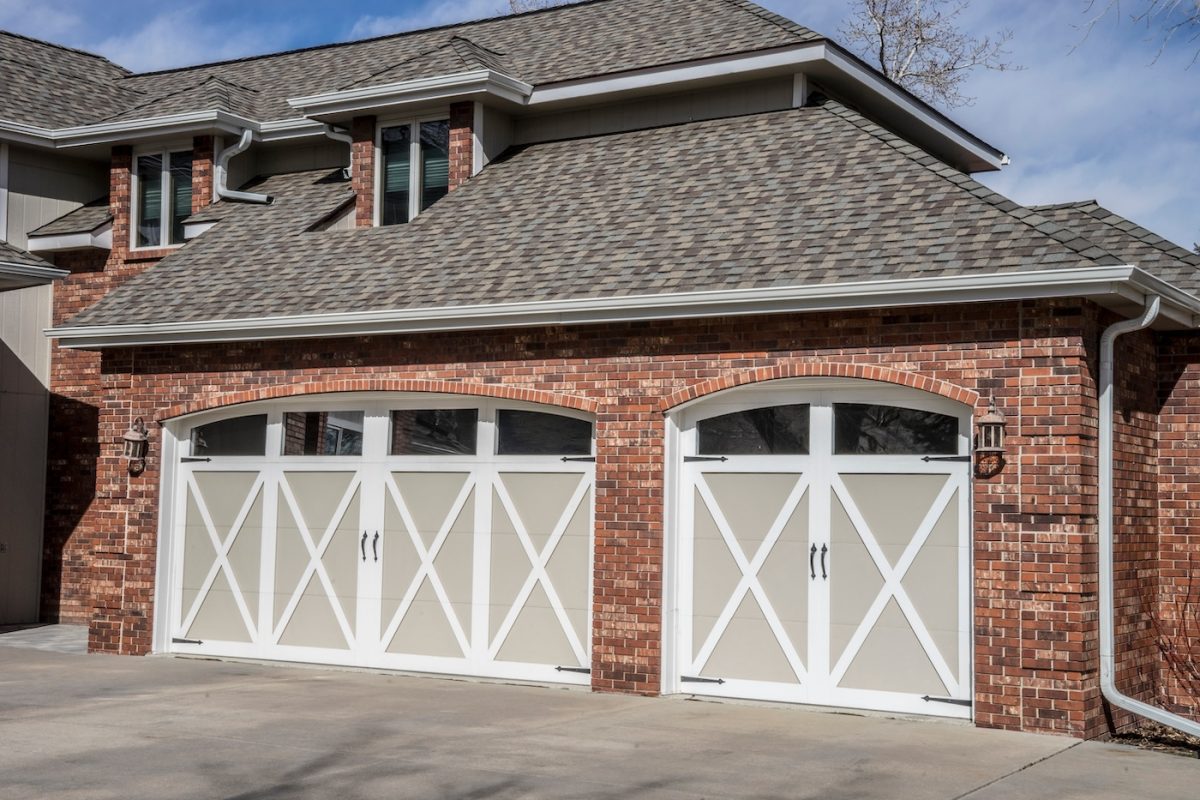 red brick home with gray roof shingles
